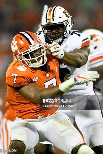 Offensive lineman Prince Tega Wanogho of the Auburn Tigers blocks Defensive end Austin Bryant of the Clemson Tigers during the football game at...