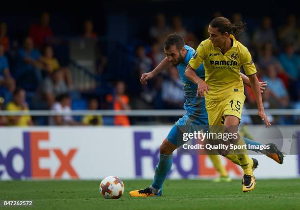 Enes Unal of Villarreal competes for the ball with Marin Anicic of Astana during the UEFA Europa League group A match between Villarreal CF and FK...