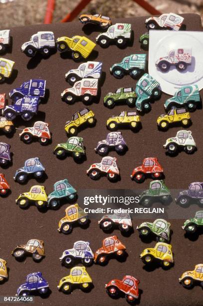 Citroen 2cv lapel pin badges on sale during world meeting of 2cv friends in July 23, 1989 in Orleans, France.
