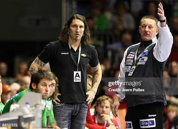 Head coach Michael Biegler and teammanager Stefan Kretzschmar of Magdeburg gesture during the Toyota Handball Bundesliga match between SC Magdeburg...