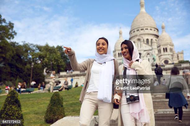 arab youth in paris - middle eastern millennials - veil stock pictures, royalty-free photos & images