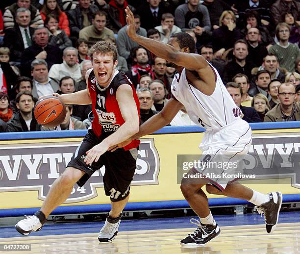 Martynas Gecevicius, #31 of Lietuvos Rytas competes with Paul Johnson, #9 of Artland Dragons in action during the Eurocup Basketball Last 16 Game 3...