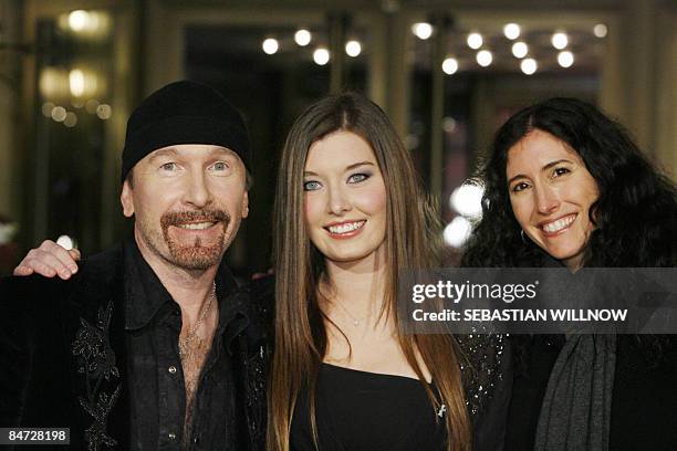 Guitarist of Irish rock group U2, David Evans , his wife Morleigh Steinberg and daughter Holly pose prior to the premiere of the film "It Might Get...