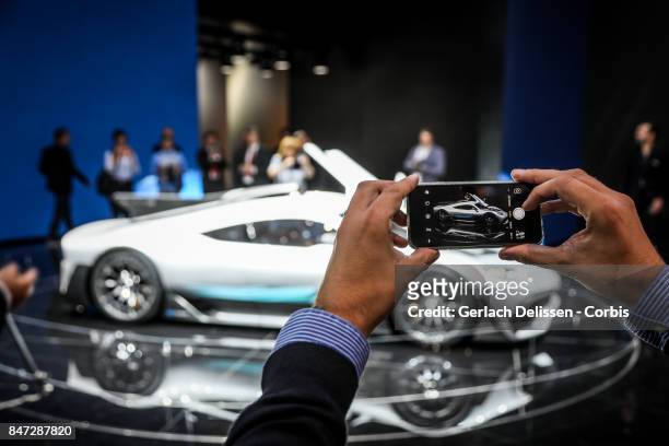 Someone taking a phone picture of The Mercedes AMG Project ONE on display at the 2017 Frankfurt Auto Show 'Internationale Automobil Ausstellung' on...