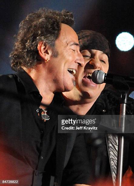 Musician Bruce Springsteen and Guitarist Steven Van Zandt of the E Street Band perform at the Bridgestone halftime show during Super Bowl XLIII...