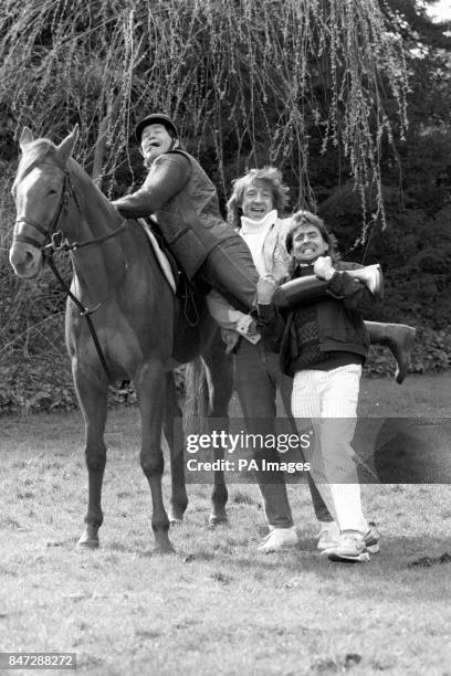 Zany sixties cult band The Monkees enjoying a bit of horseplay on drummer Micky Dolenz's eight-acre estate near Newark in Nottinghamshire. The group...