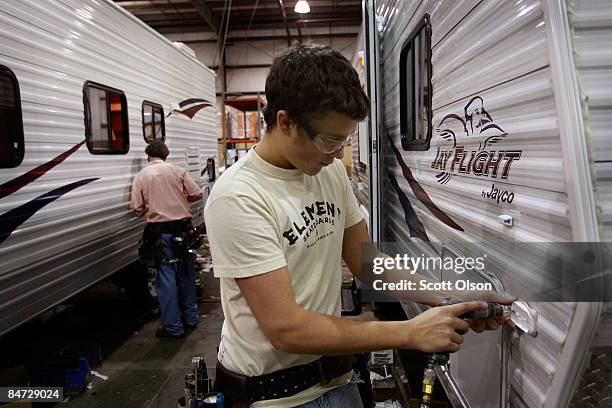 Workers at Jayco, Inc., the country's third largest maker of recreational vehicles, build Jay Flight travel trailers February 10, 2009 in Middlebury,...