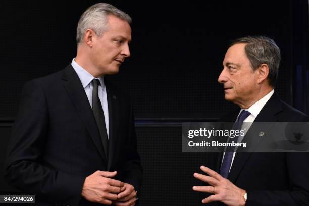 Bruno Le Maire, France's finance minister, left, speaks to Mario Draghi, president of the European Central Bank , ahead of a Eurogroup meeting in...