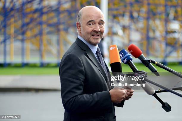 Pierre Moscovici, economic commissioner for the European Union , speaks to the media after arriving for a Eurogroup meeting in Tallinn, Estonia, on...