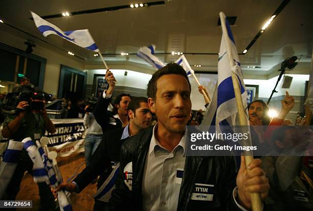 Supporters of Avigdor Lieberman and the Yisrael Beiteinu party react after hearing exit poll results at party headquarters February 10, 2009 in...