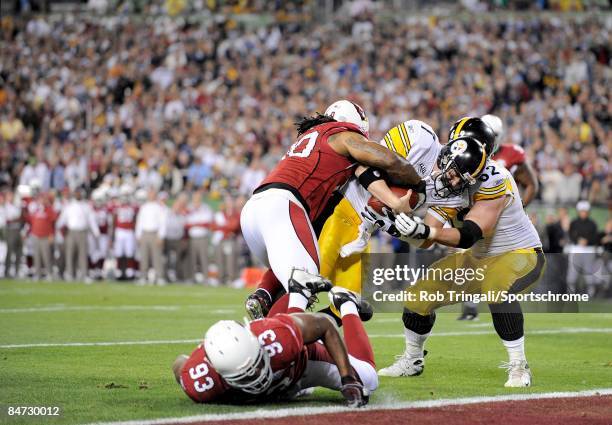 Quarterback Ben Roethlisberger of the Pittsburgh Steelers runs with the ball against the Arizona Cardinals during Super Bowl XLIII on February 1,...