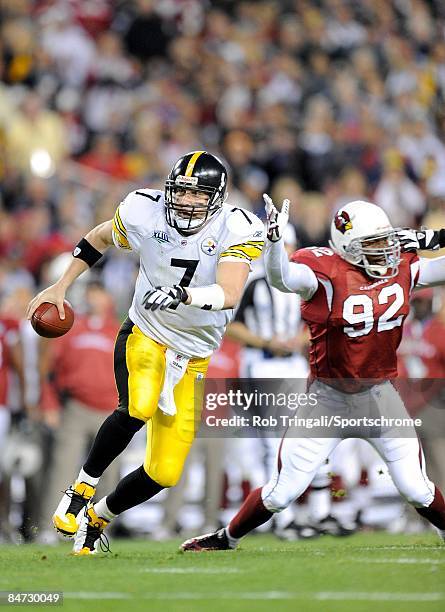 Quarterback Ben Roethlisberger of the Pittsburgh Steelers runs with the ball against the Arizona Cardinals during Super Bowl XLIII on February 1,...