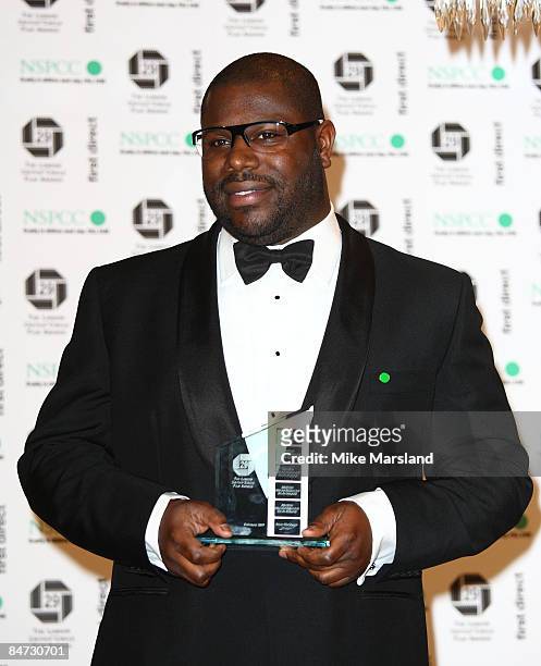 Director Steve McQueen holds his award for Best Breakthrough British film-maker at The 29th Annual London Critics' Circle Film Awards at Grosvenor...