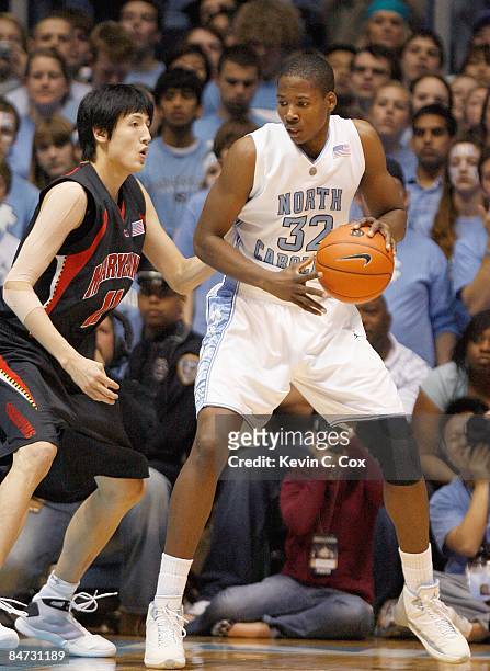 Ed Davis of the North Carolina Tar Heels looks to move the ball against Jin Soo Kim of Maryland Terrapins during the game on February 3, 2009 at the...
