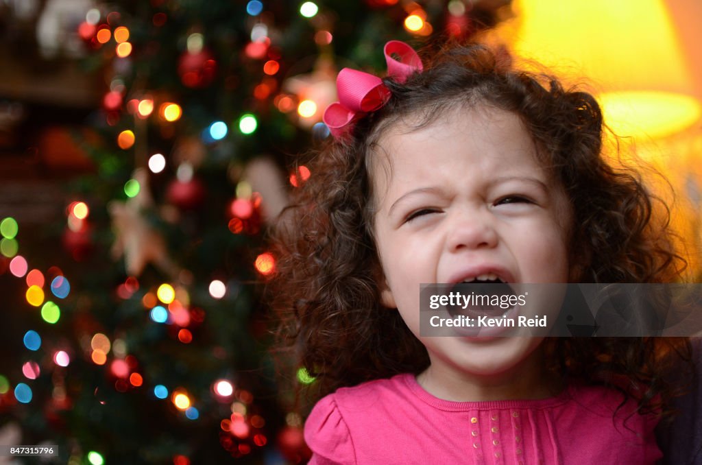 A small child crying at Christmas