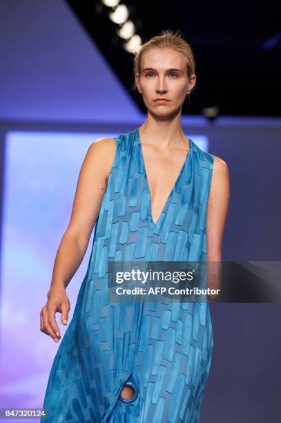 Model Kelly Knox presents a creation by British fashion house Teatum Jones for their Spring/Summer 2018 collection on the first day of London Fashion...