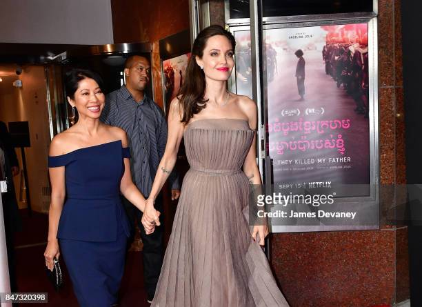 Loung Ung and Angelina Jolie leave the DGA Theater for the New York premiere of 'First They Killed My Father' on September 14, 2017 in New York City.