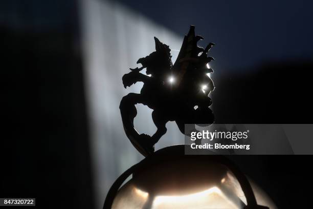 City of London dragon symbol sits atop of a lamppost in the City of London, U.K., on Friday, Sept. 15, 2017. The pound climbed to the highest level...