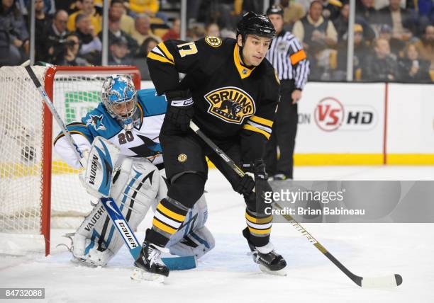Evgeni Nabokov of the San Jose Sharks watches the play against Milan Lucic of the Boston Bruins at the TD Banknorth Garden on February 10, 2009 in...