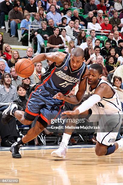 Raja Bell of the Charlotte Bobcats makes a move to the basket against C.J. Miles of the Utah Jazz during the game at the EnergySolutions Arena on...