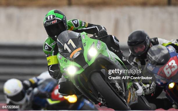 France's Randy De Puniet rides his Kawasaki ZX-10R during a qualifying session of the 81st Bol d'Or 24-hour motorbike endurance race, on September...