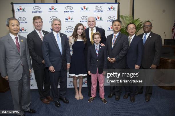 Ahn Ho-Young, Don Beyer, Mike McCall, Hannah Adams, Mike Kelly, Ryan Darby, Harry Han, Charlie Kim and Zafar Brooks attend Hyundai 'Hope For Wheels'...