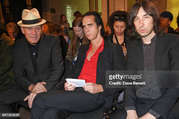 Paul Simonon, Nick Cave and Bobby Gillespie attend the Pam Hogg SS18 catwalk show at Freemasons Hall during London Fashion Week on September 15, 2017...
