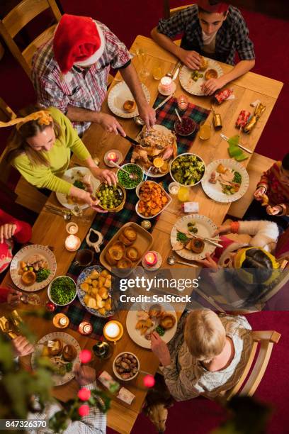 christmas dinner with the family - christmas dinner stock pictures, royalty-free photos & images