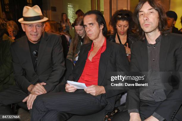 Paul Simonon, Nick Cave and Bobby Gillespie attend the Pam Hogg SS18 catwalk show at Freemasons Hall during London Fashion Week on September 15, 2017...