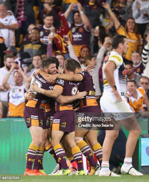 The Broncos celebrate a try during the NRL Semi Final match between the Brisbane Broncos and the Penrith Panthers at Suncorp Stadium on September 15,...