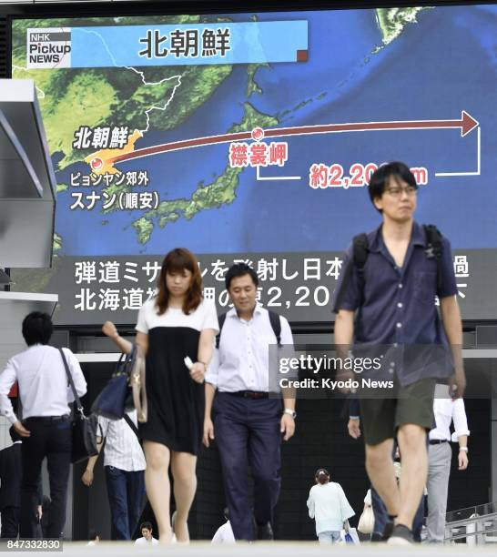 Large TV screen in Tokyo's Akihabara district on Sept. 15 shows a report that North Korea has test-fired a ballistic missile over northern Japan that...