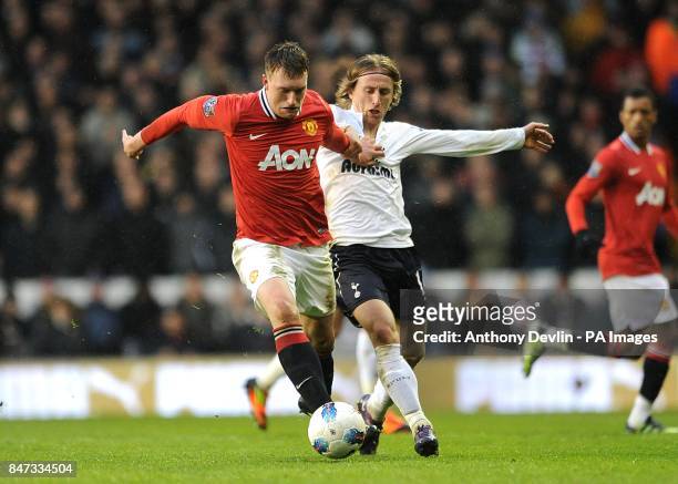 Manchester United's Phil Jones and Tottenham Hotspur's Luka Modric battle for the ball
