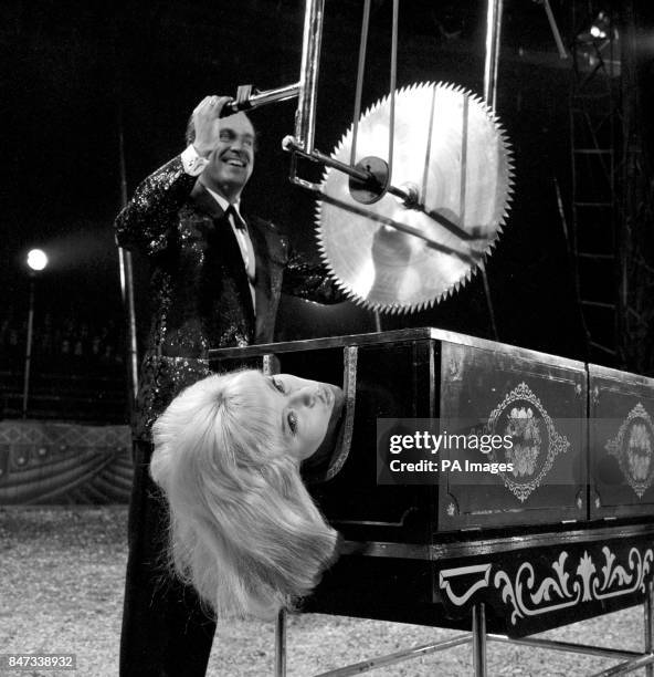 Welsh actor Philip Madoc, who plays an illusionist, and Diana Dors in a scene from the film "Circus of Blood" at Shepperton Studios.