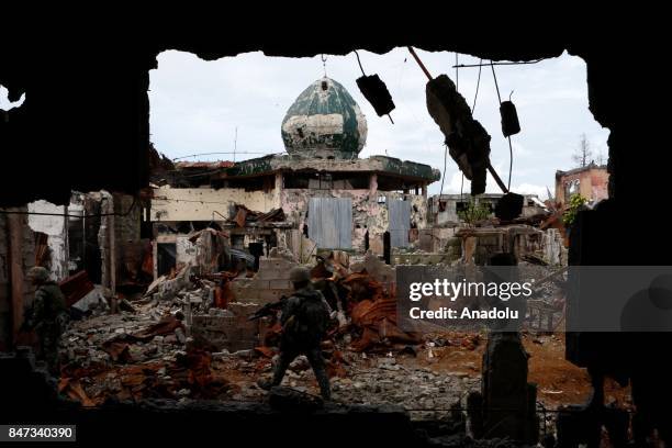 Members of the Philippine Marines 1st Brigade conduct clearing operation at the main battle zone to liberate the ruined city from the presence of...