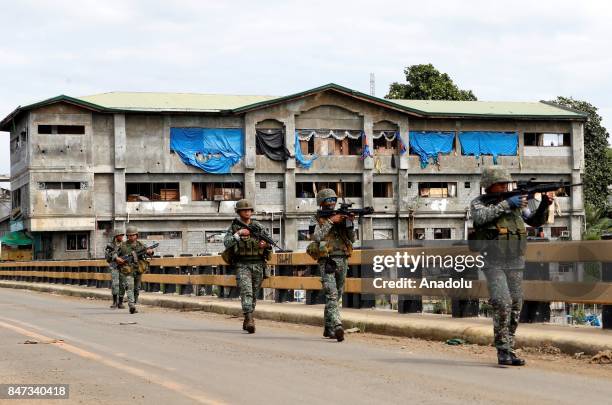 Members of the Philippine Marines 1st Brigade conduct clearing operation at the main battle zone to liberate the ruined city from the presence of...