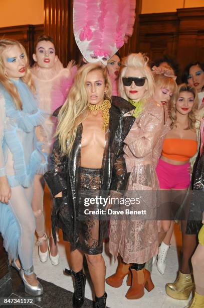 Alice Dellal and designer Pam Hogg pose with models backstage at the Pam Hogg SS18 catwalk show during London Fashion Week September 2017 on...