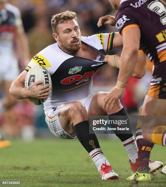 Bryce Cartwright of the Panthers takes a tackle during the NRL Semi Final match between the Brisbane Broncos and the Penrith Panthers at Suncorp...