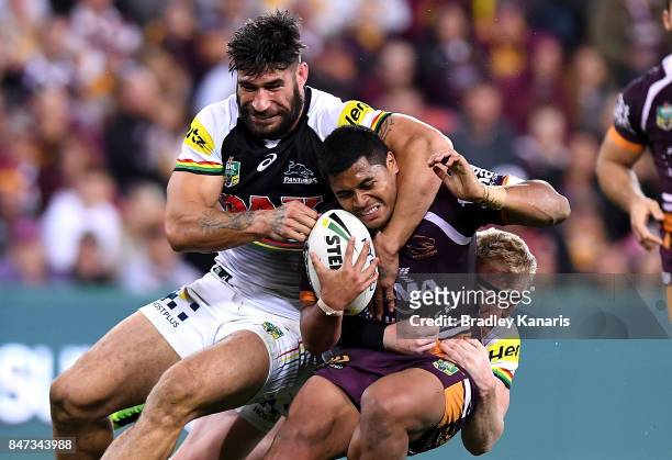 Anthony Milford of the Broncos is wrapped up by the defence during the NRL Semi Final match between the Brisbane Broncos and the Penrith Panthers at...