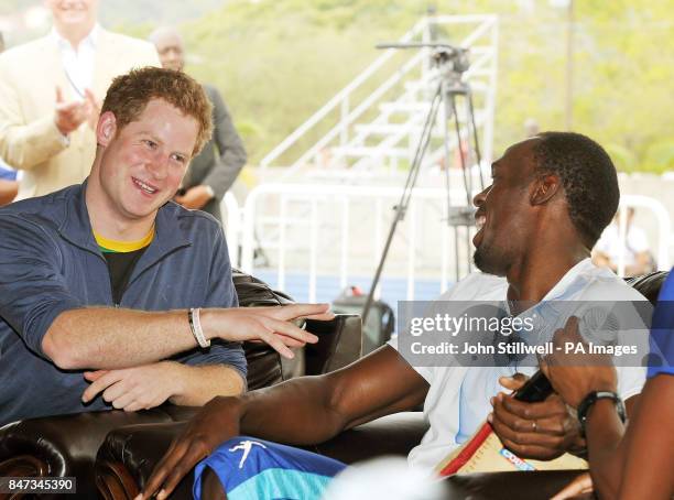 Prince Harry with Olympic sprint champion Usain Bolt during a question and answer session, at the University of the West Indies, in Jamaica where the...