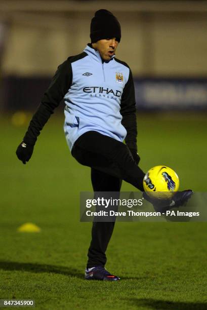 Manchester City's Carlos Tevez warms up before the Manchester Senior Cup match at Ewen Fields, Hyde.