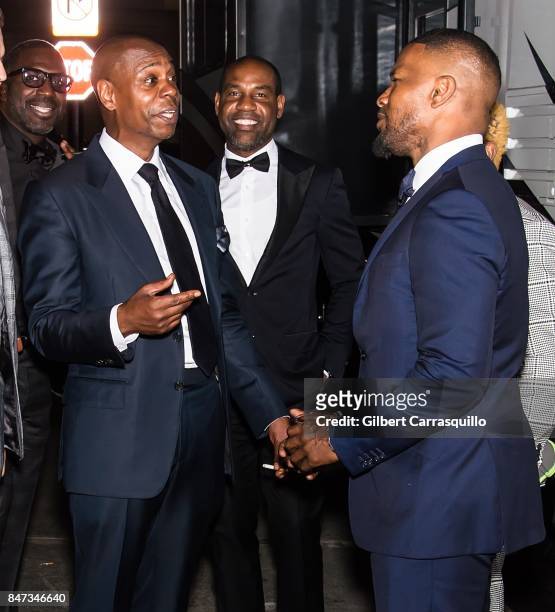 Comedian Dave Chappelle, Unik Ernest and actor Jamie Foxx are seen during Rihanna's 3rd Annual Diamond Ball Benefitting The Clara Lionel Foundation...
