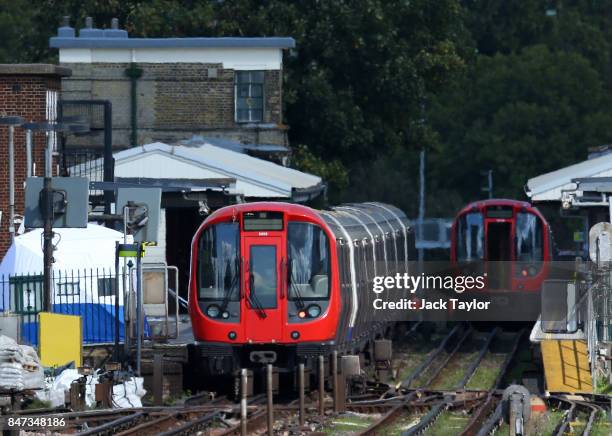 Forensic tent is seen next to the stopped tube train at Parsons Green Underground Station on September 15, 2017 in London, England. Several people...