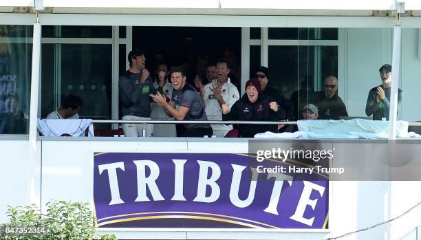 The Somerset side celebrate victory from the balcony during Day Four of the Specsavers County Championship Division One match between Somerset and...