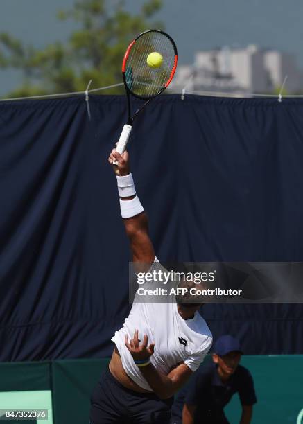 Pakistan's Aisam-Ul-Haq Qureshi serves during the Davis Cup Asia-Oceania Group-II tennis singles match against Thailand's Kittiphong Wachiramanowong...