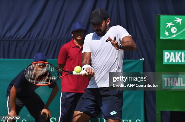 Pakistan's Aisam-Ul-Haq Qureshi hits a return during the Davis Cup Asia-Oceania Group-II tennis match against Thailand's Kittiphong Wachiramanowong...