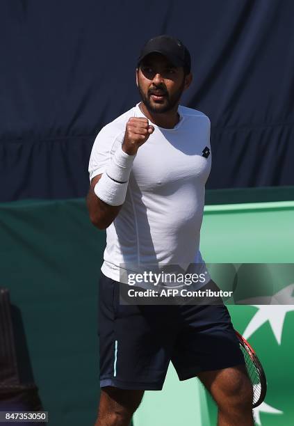 Pakistan's Aisam-Ul-Haq Qureshi gestures after winning the Davis Cup Asia-Oceania Group-II tennis match against Thailand's Kittiphong Wachiramanowong...