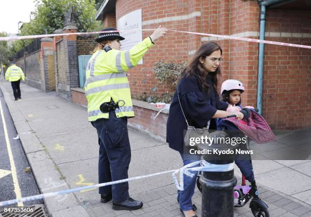 Child evacuates from a school in London on Sept. 15 after an explosion occurred in a subway car near Parsons Green station. ==Kyodo