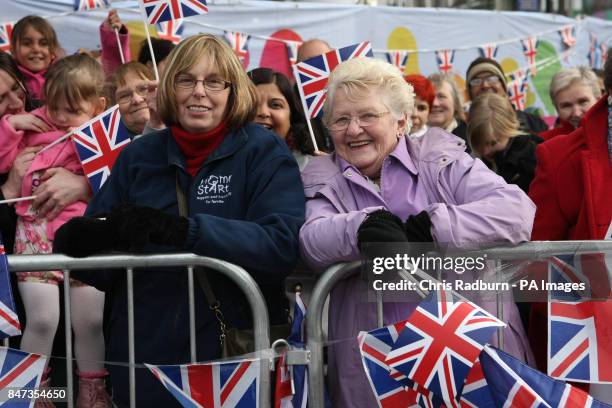 Wellwishers Janet Sanders from Wellingborough and Jennifer Shenton from Blaby, await the arrival of Queen Elizabeth II, the Duke of Edinburgh and the...