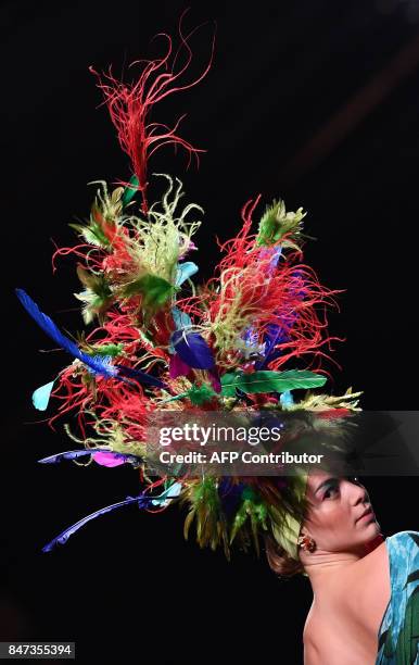 Model presents a creation of Francis Montesinos' Spring/Summer 2018 collection during the Madrid Fashion Week in Madrid on September 15, 2017. / AFP...