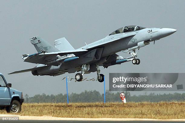 Navy F/A-18F Super Hornet takes off for a flight demonstration during the inauguration of Aero India 2009 at the Yelahanka Air Force Station in...